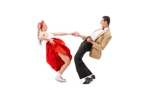 惊讶的年轻男子和女子在复古风格的服装跳舞林迪跳孤立的白色背景。艺术、音乐、时尚、风格概念图片下载