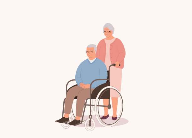 老年妻子推轮椅与残疾的老年丈夫。图片下载