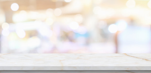 大理石桌面与模糊的厨房咖啡馆餐厅内部背景图片下载