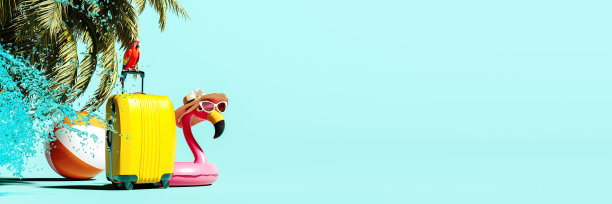 黄色行李箱与粉红色的火烈鸟和棕榈树在蓝绿色的背景。夏天旅游的概念。图片下载