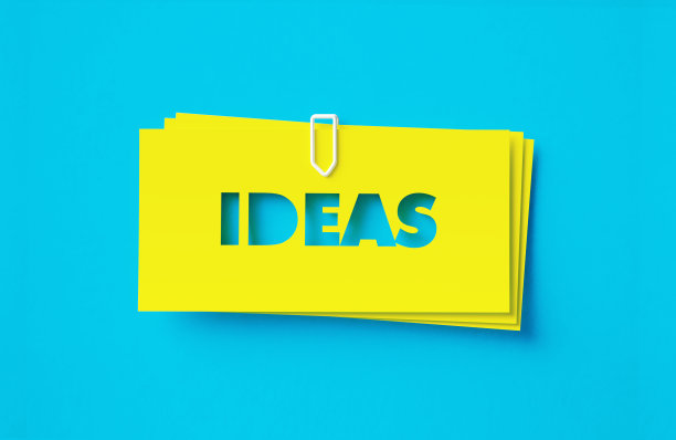 在绿松石色的背景上剪下黄色的黏贴图片下载