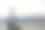 雾蒙蒙的日落在旧金山海湾大桥和海滨图片下载