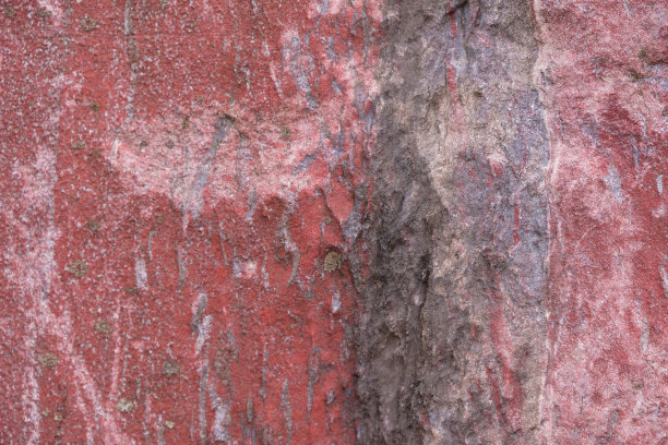 红色石头的背景。装饰效果。部分模糊。图片下载