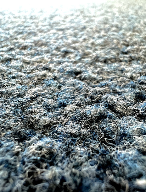 粗蓝灰色织物作为纹理或背景的微距图像。图片下载