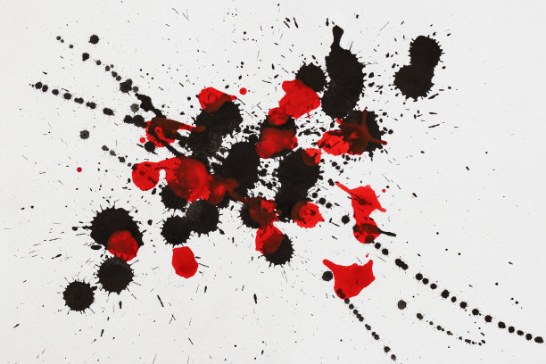 红色和黑色飞溅，滴在白色背景。在纸上手绘的颜料斑点图片下载