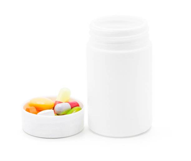 打开白色塑料药瓶，瓶盖与各种药物隔离在白色背景上，具有裁剪路径，医学和药物概念，正面视图照片图片下载