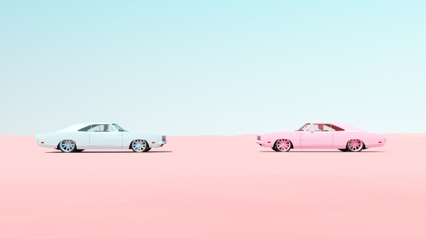 粉色和蓝色的复古肌肉车头到头比赛满足沙漠，沙子，蓝天阳光图片下载