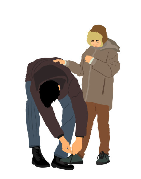 父亲给儿子们系鞋带图片下载