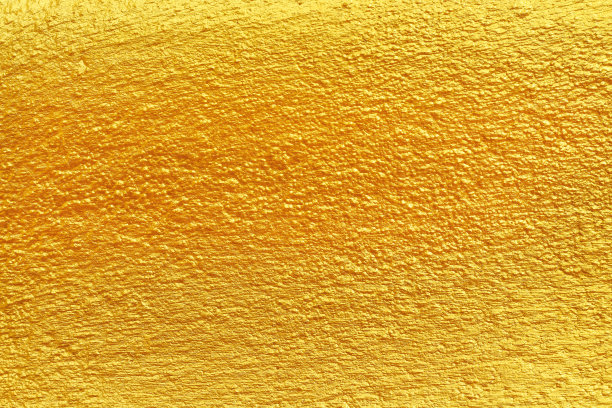 混凝土墙与金黄橙涂料与凹凸不平无缝图案的彩色背景图片下载