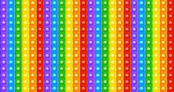 彩色硅胶抗压弹出它的玩具纹理，图案。新潮的儿童感官游戏。彩虹推流行fidget玩具鲜艳的颜色弹出泡泡。矢量图图片下载