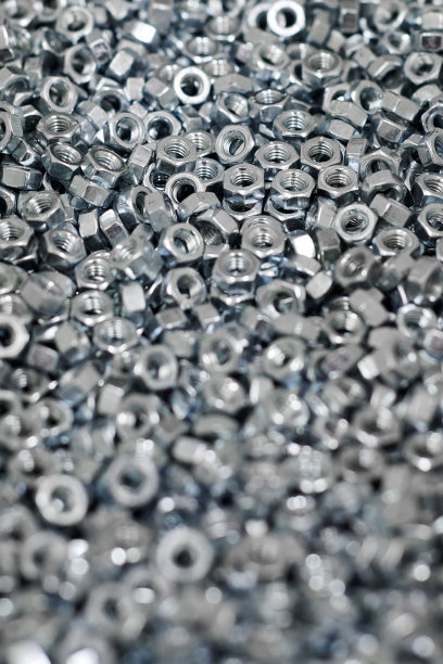 一束镀锌六角螺母，用于将多个部件紧固在一起的螺栓，五金紧固件图片下载