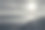 一个大湖在夕阳的照耀下，在铺满混凝土板的岸边，一个孤独的渔夫站在那里捕鱼图片下载