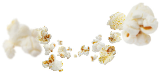 白色的爆米花在空中飞舞图片下载