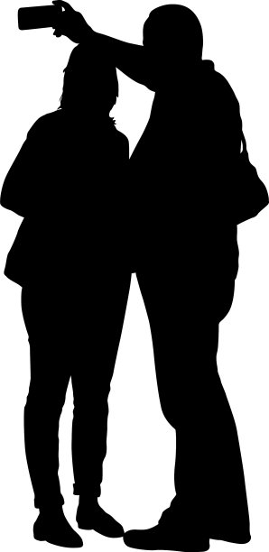 剪影男子正戴着智能手机自拍图片下载