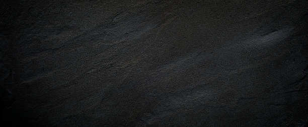 黑色或深灰色粗糙的颗粒状石材或砂石纹理背景图片下载