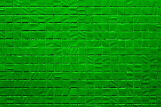 这面墙的纹理衬有绿色的马赛克。图片下载