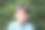 一个9岁的男孩专注地看着镜头图片下载