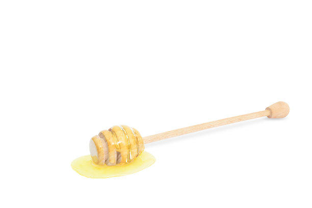 蜂蜜粘在白色背景的水平位置图片下载