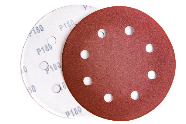 白色背景上带有180粒砂砾魔术贴的圆形砂纸盘图片下载