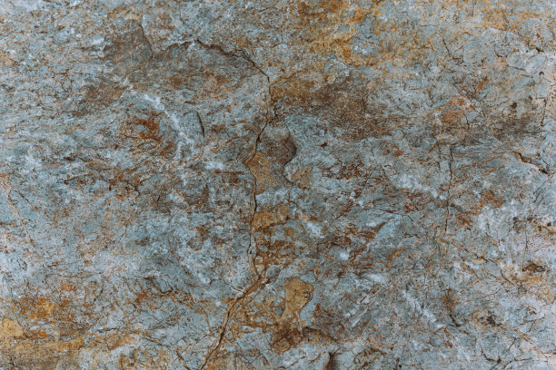 天然有纹理的灰色石材，纹理呈黄色和棕色图片下载