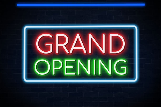 开业霓虹灯招牌，砖墙背景。图片下载