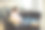 美丽的年轻女子在家里躺在沙发上用笔记本电脑工作或学习的侧面视图。女性躺在沙发上用电脑打字图片下载