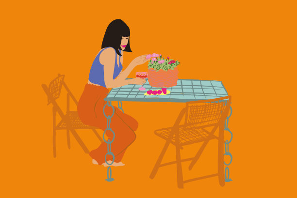 坐在花园桌边的时髦女人图片下载