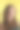 美丽的女孩与飘逸的头发在黄色的背景。深色头发的女士穿着漂亮的衬衫和牛仔裤在摄影棚里摆拍……图片下载