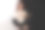 美丽的红发年轻女子读书，而坐在椅子上，双腿交叉超过一半的黑白背景图片下载