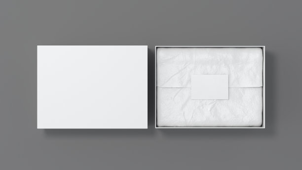 礼品盒模拟盖。白色礼品盒，空白标签或名片上的包装纸。灰色的背景。视图上方。图片下载