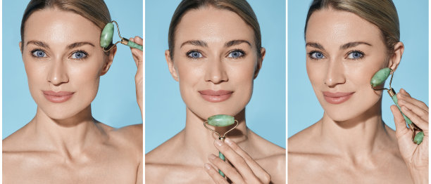 女人按摩她的脸使用一个绿色的玉石滚轮弹性完美的皮肤，复合形象与概念。面玉辊，概念图片下载
