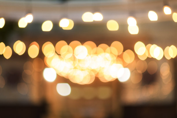 复古的色调模糊的形象的食品摊在晚上的节日与散景图片下载