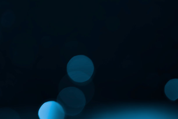 蓝色闪光散景背景。图片下载