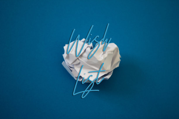 愿望清单文本撕裂，皱巴巴的白纸彩色背景。图片下载