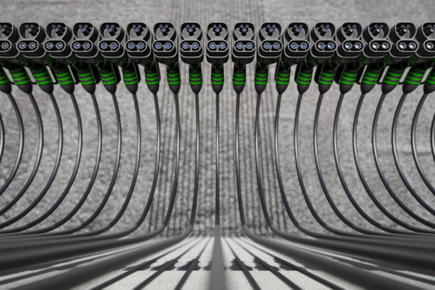 混凝土背景上的一排电动汽车电池连接插头的3D表示。图片下载