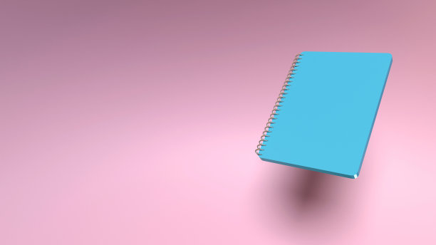 回到学校的概念与蓝色精装便签本上的粉红色珊瑚背景图片下载