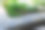 在公园里有规则形状的池塘上方铺设的粗糙的石灰石。tralk床。灰色和棕色混合的扁平石瓦图片下载