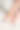 白色房间里的一位女士穿着米色紧身丝袜。女孩在家里穿长袜。漂亮的女腿图片下载
