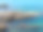 海里的岩石。地中海风景如画的岩石海岸。清澈闪亮的绿松石水。图片下载