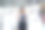 女设计师或卖家在婚礼时装商店的衣服附近做笔记图片下载