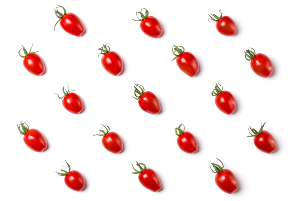 分离于黄色背景的樱桃番茄的食物形态。平铺，俯视图。图片下载