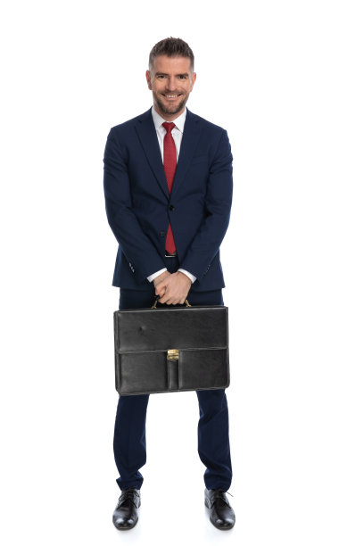 商人站着，拿着一个黑色的箱子图片下载