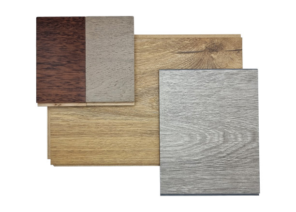 多种类型的室内木地板覆盖材料样品，包括灰乙烯基地板，橡木灰和意大利胡桃木工程地板隔离在白色背景与修剪路径。图片下载
