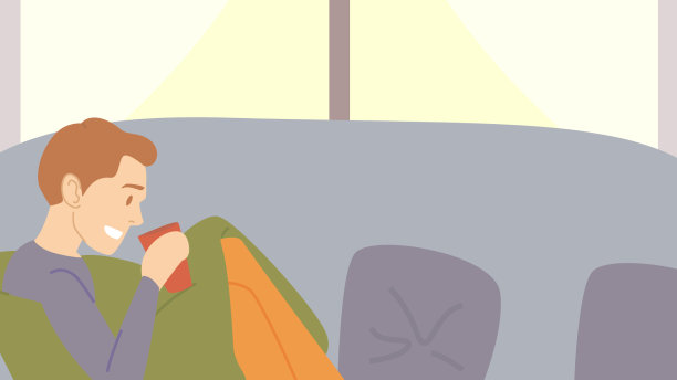 坐在沙发上喝咖啡或茶的男人图片下载