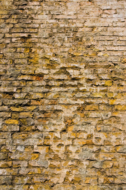 砖墙纹理背景。混色工业砖墙。瓷砖。复古的效果。乡村建筑中的黄色砖墙背景图片下载