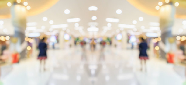 抽象模糊服装精品展示商场内部的背景图片下载