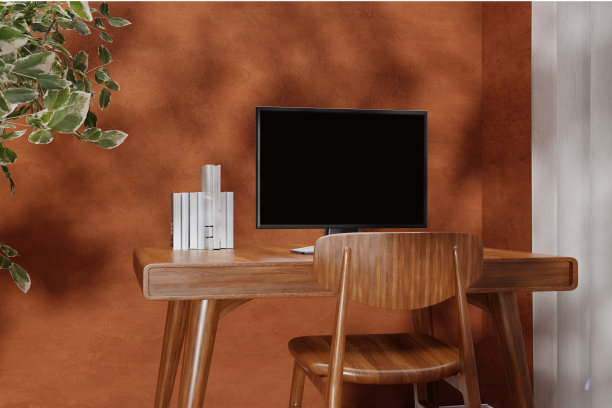 由阳光照射的墙壁旁的木制工作桌上的一台台式电脑的3d渲染插图。图片下载