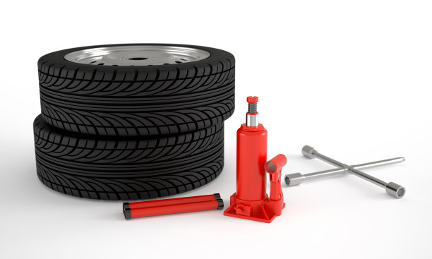 带有十字扳手和液压千斤顶的汽车车轮。轮胎装配概念图片下载