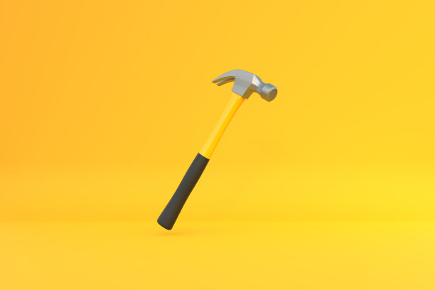 黄色背景上孤立的黄色塑料柄羊角锤图片下载