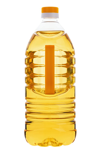 烹饪葵花油瓶孤立在白色背景。塑料瓶装植物有机油。图片下载